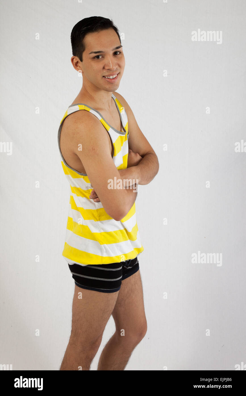 Young man looking happy in tank top, with his arms crossed Stock Photo