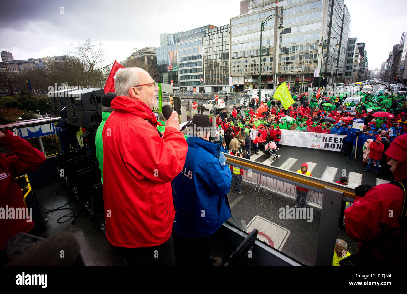 Brussels, Belgium. 30th Mar, 2015. An union leader giving his speech to the crowd on top of a double decker bus. - Thousands took part in an anti austerity demonstration organized by multiple workers' unions and political parties. Clash broke out as members of 'LCR' (Revolutionary Communist League of Belgium) tries to take over the stage. Credit:  Geovien So/Pacific Press/Alamy Live News Stock Photo