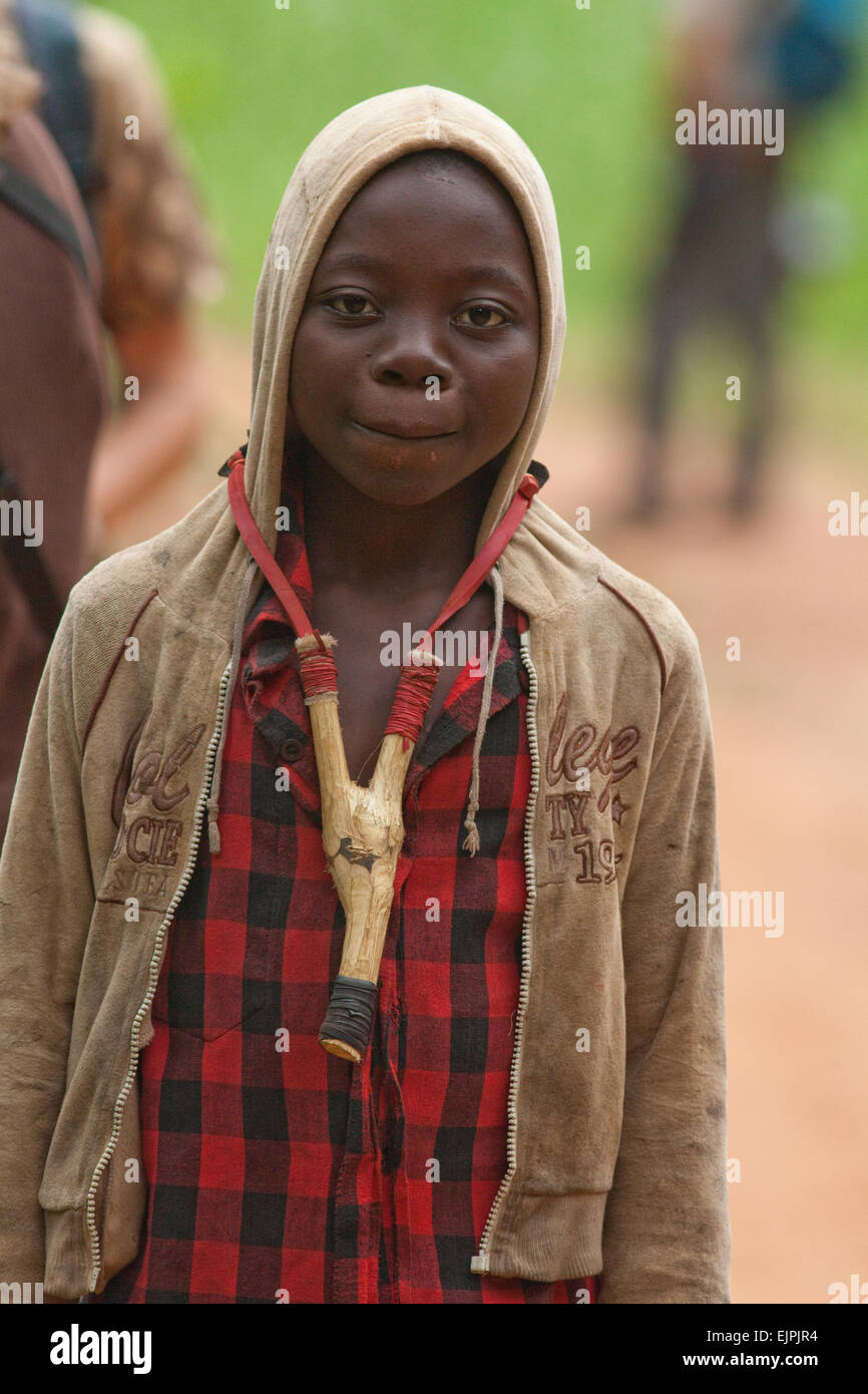 Boy hunter, with catapult. Ghana. West Africa. Stock Photo