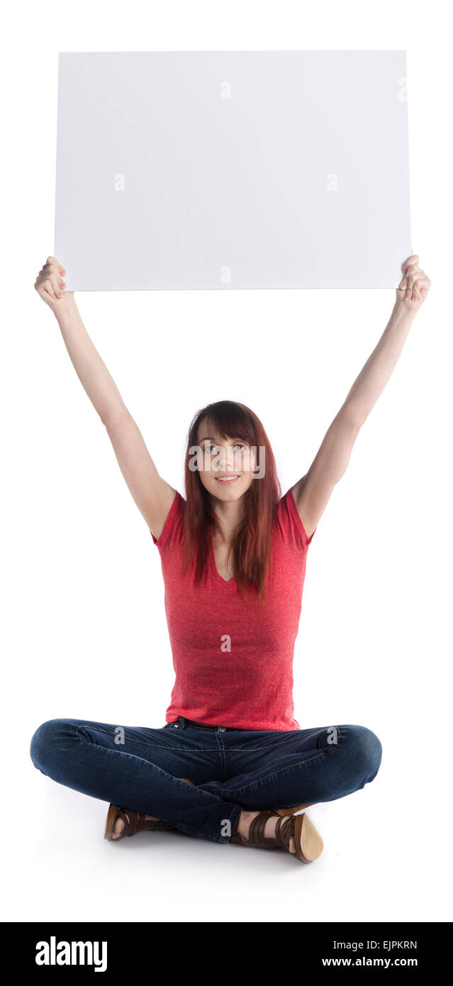 Young Woman Sitting on Floor Raising a Cardboard Stock Photo