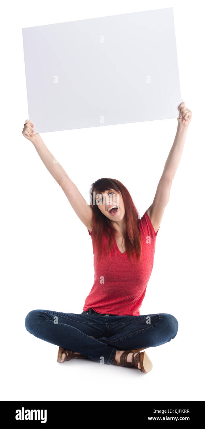 Happy Girl Sitting on the Floor Raising Cardboard Stock Photo