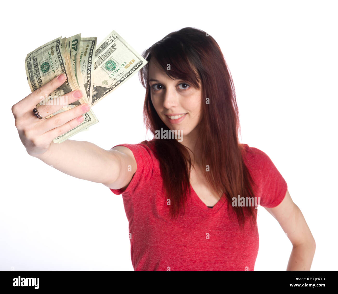 Smiling Woman Holding a Fan of 20 US Dollar Bills Stock Photo