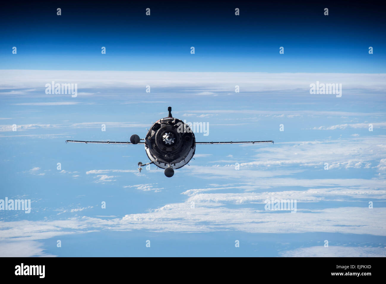 The Russian Soyuz TMA16M spacecraft approaches the International Space Station for docking March 28, 2015 in Earth Orbit. The Soyuz is carrying NASA Astronaut Scott Kelly and Russian cosmonauts Gennady Padalka and Mikhail Kornienko. Stock Photo
