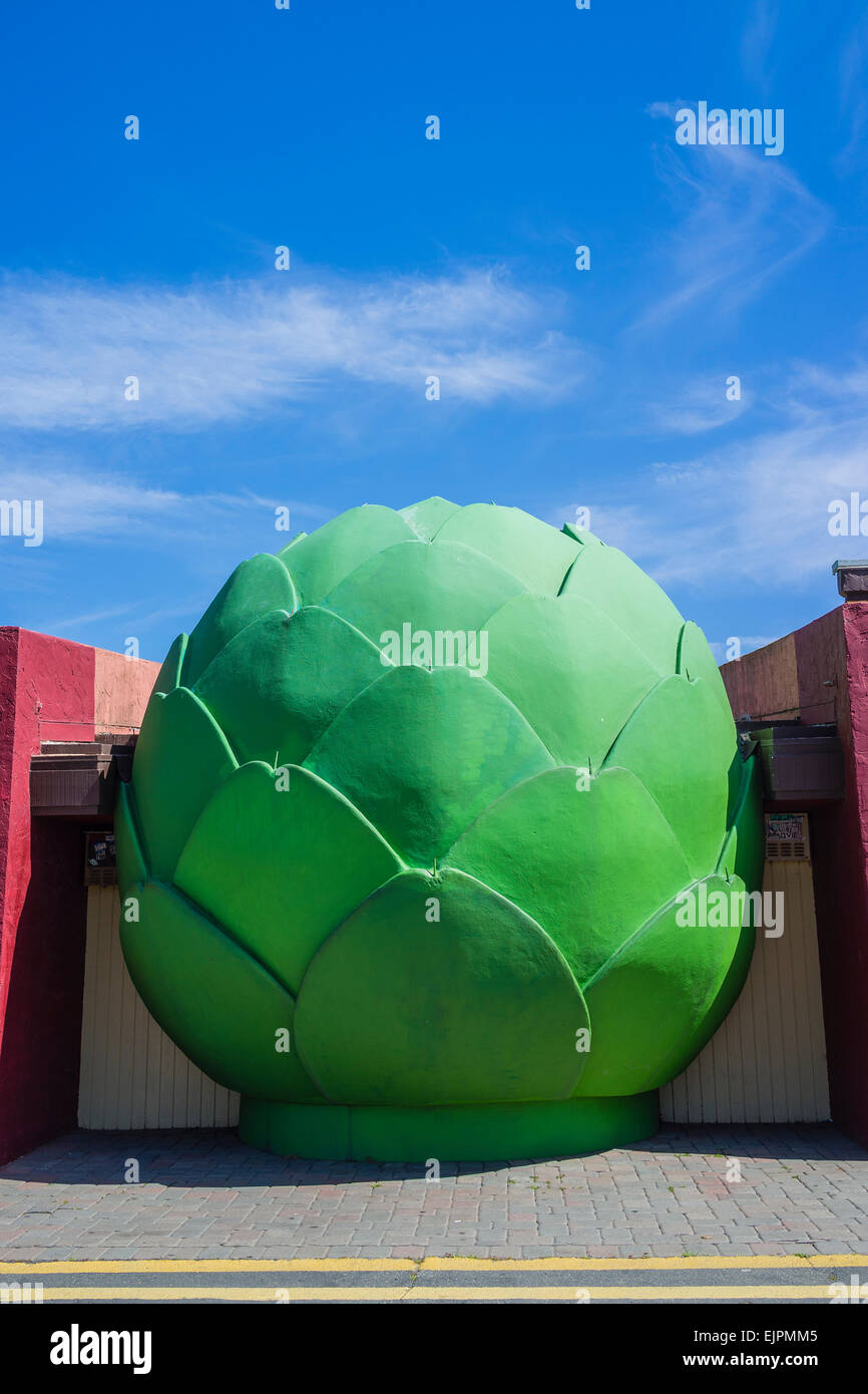 A colossal sized artichoke sculpture outside a building in Castroville