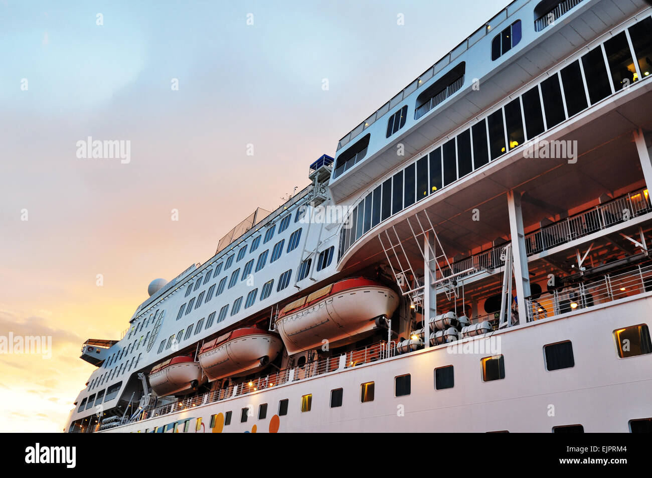 Cruise ship at sunset Stock Photo - Alamy