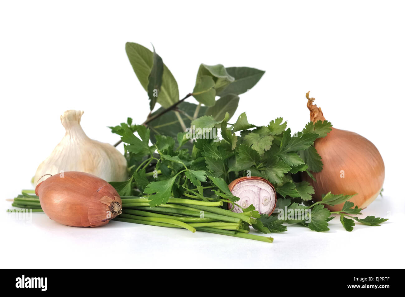 garlic,onions and shallots with herbs on white background Stock Photo