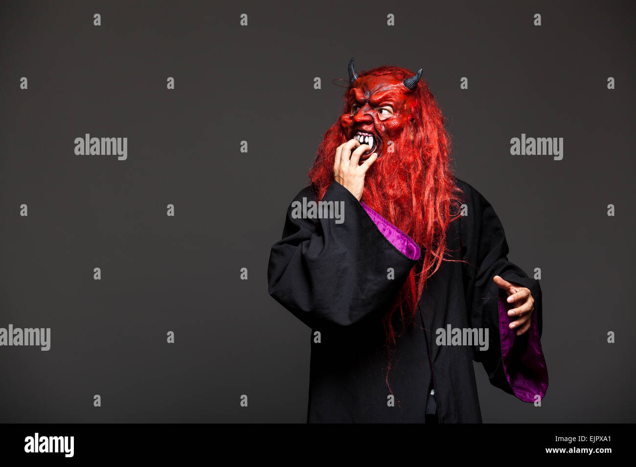 halloween monster with red face on dark background Stock Photo - Alamy