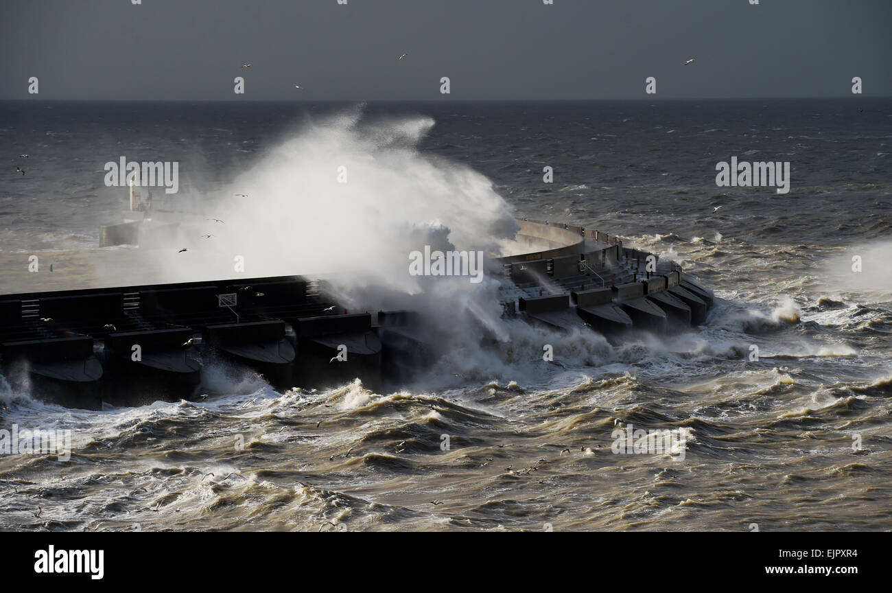 Brighton UK 31st March 2015 - Huge waves crash over Brighton Marina this morning as high winds and storms batter the coast of Britain today Credit:  Simon Dack/Alamy Live News Stock Photo