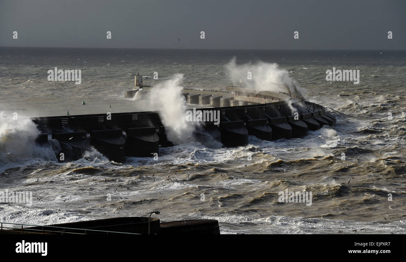 Brighton UK 31st March 2015 - Huge waves crash over Brighton Marina this morning as high winds and storms batter the coast of Britain today Credit:  Simon Dack/Alamy Live News Stock Photo