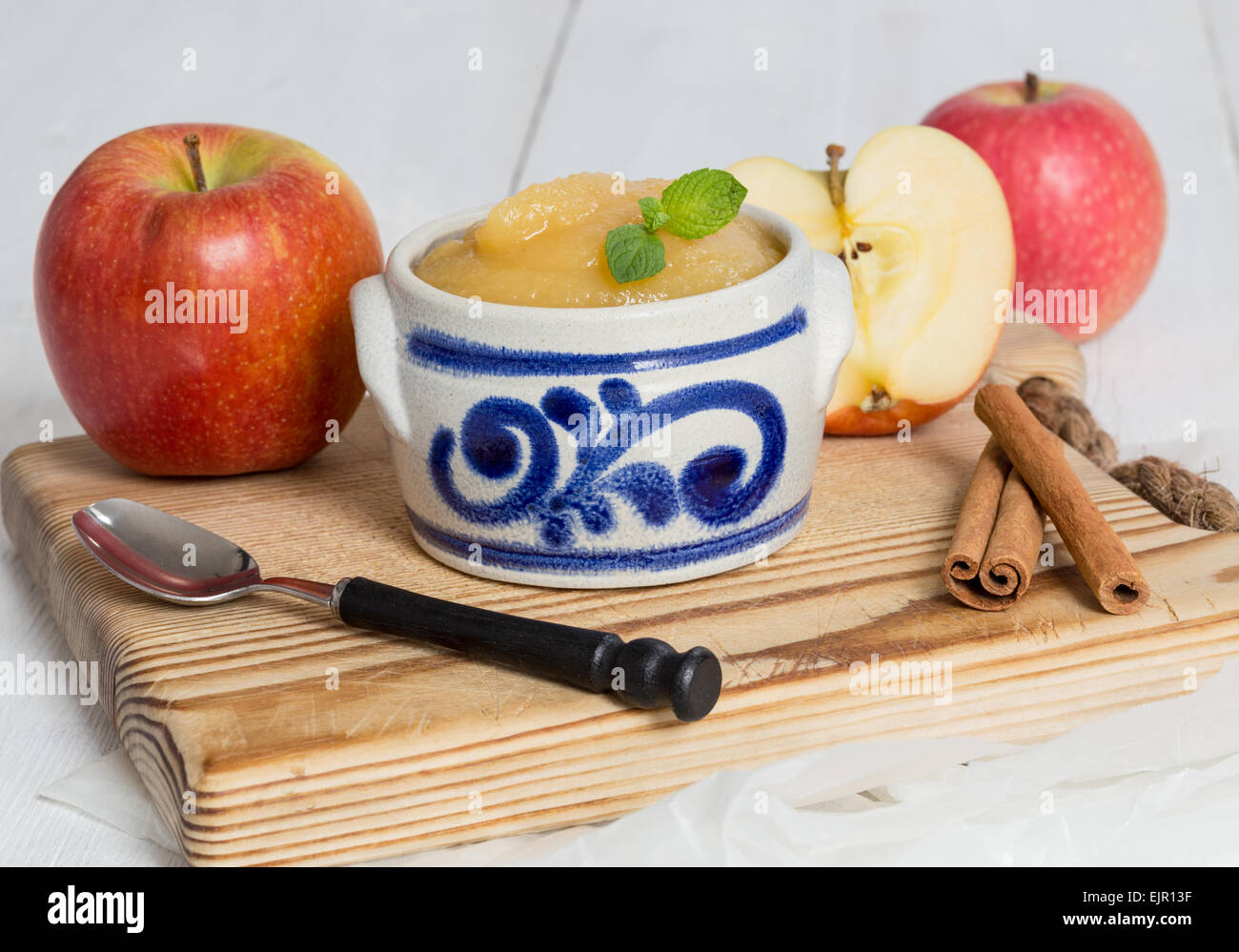 Applesauce with cinnamon in stoneware bowl Stock Photo Alamy