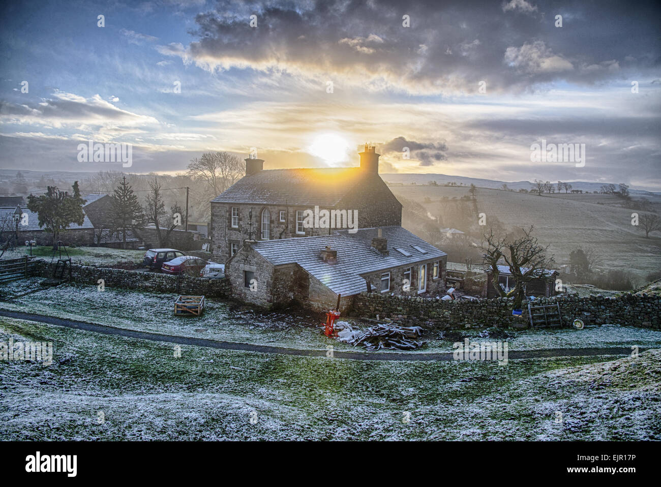 View of farmhouse in frost at sunrise, Church Brough, Kirkby Stephen, Cumbria, England, December