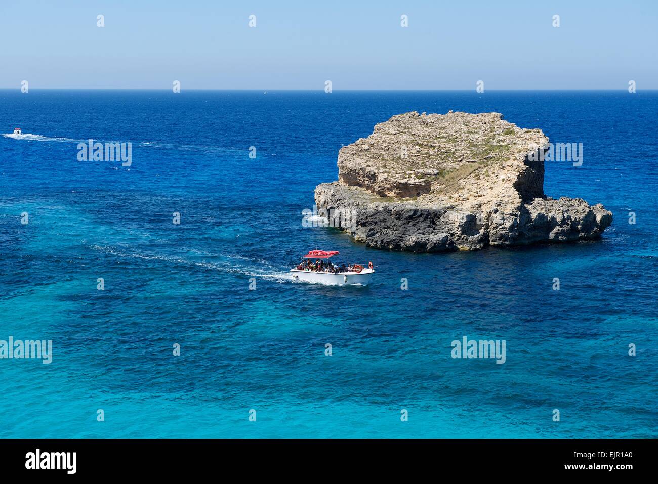 Nice view in Malta island with boat in the clear blue sea,touristic destination in Malta, Comino island,tour to Comino in Malta Stock Photo