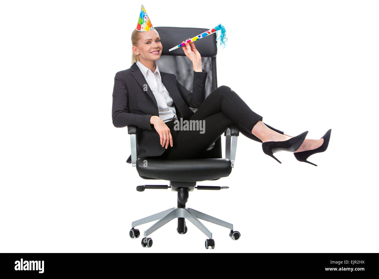 blonde businesswoman smiling and having fun during a party in the office Stock Photo