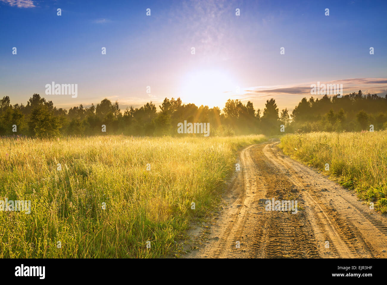 the rural landscape with sunrise and the road Stock Photo - Alamy