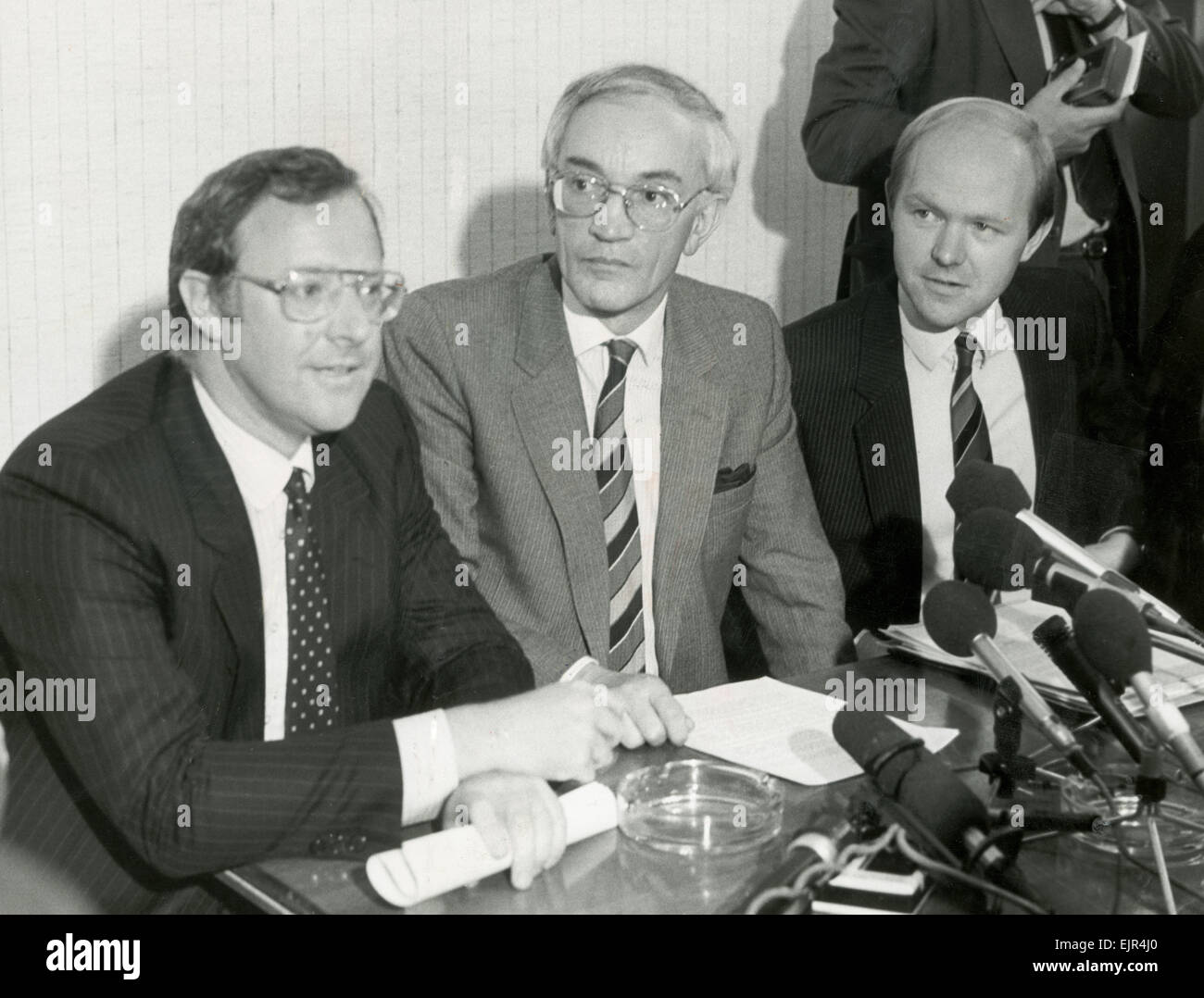 Manchester deputy police chief John Stalker, head of the Stalker inquiry, an investigation into the shootings of a number of memebers of the Provisional Irish Republican Army, photographed with his lawyers at a press conference. He was temporarily suspended from duty and removed from the inquiry after allegations were made against him, which were later proven to be false. 25th June 1986. Stock Photo
