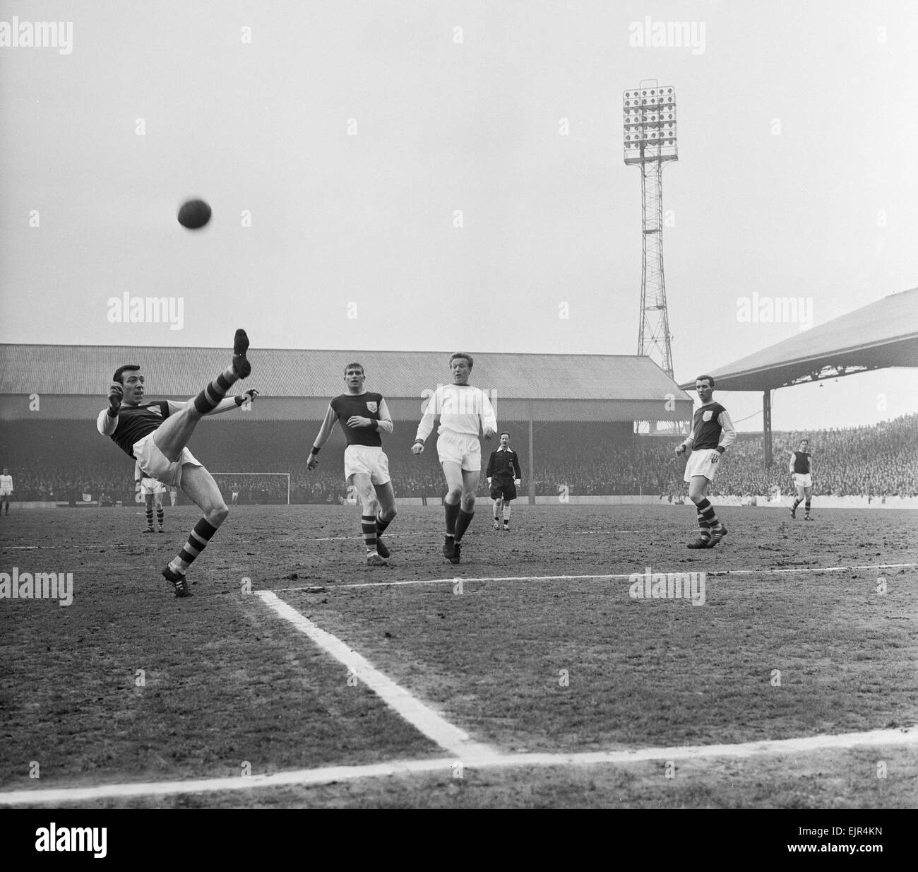 English League Division One match at Turf Moor. Burnley 0 v Manchester United 1. Burnley centre half Talbot performs a perfect overhead kick to clear a dangerous United attack watched by teammate Miller and Albert Quixall of United 4th May 1963. Stock Photo