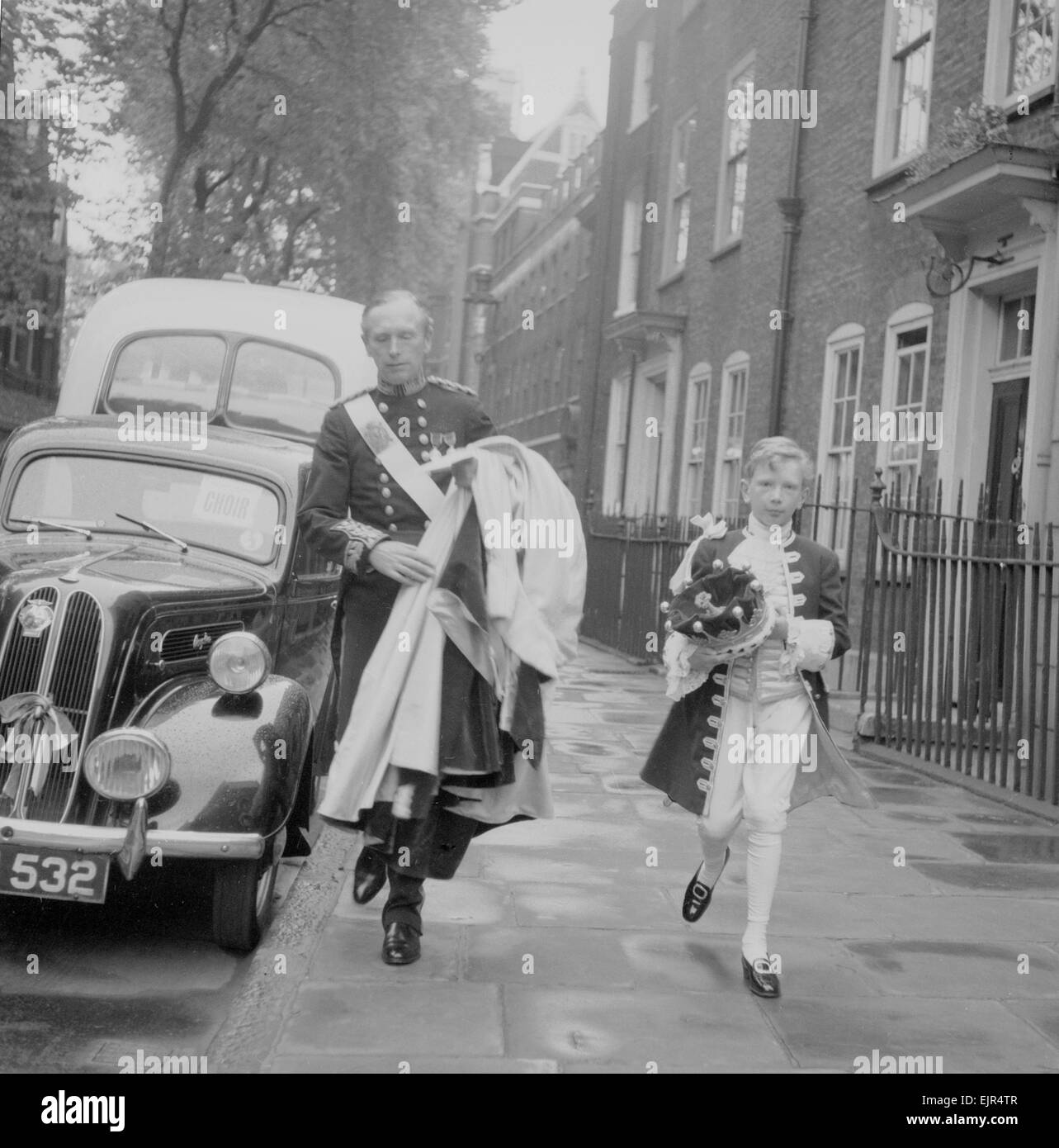 The Coronation of Queen Elizabeth II. The Rt Honourable Alec Douglas Home, 14th Earl of Home, pictured with a page boy en route to Wetminster Abbey. 2nd June 1953. Stock Photo
