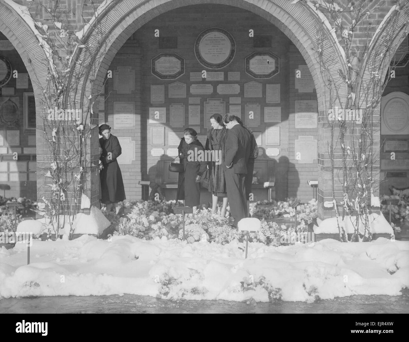 Funeral of Vicki Martin 14th January 1955 Looking at flowers sent to the West Chapel of the Golders Green Crematorium are Doreen Mewes (left) Vicki's sister and the young Jaipur Prince, son of the Maharajah of Jaipur *** Local Caption *** Published Daily Mirror Page 9 15th January 1955 watscan - - 07/01/2010 Stock Photo