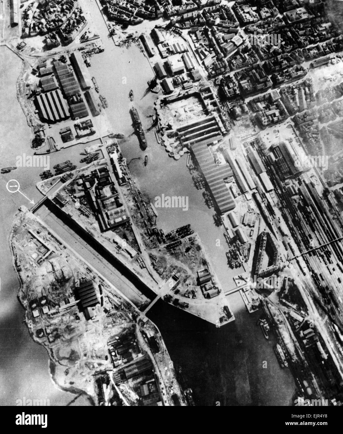 Aerial photgraph taken by an RAF reconnaisance aircraft, the day before the raid by British Royal Navy and Army commando units on the Nazi held docks at St Nazaire in occupied Northern France. In this picture the lock gate is in position (1). It would be destroyed in the raid when they were rammed by obselete destroyer HMS Campbelltown accompanied by 18 shallow boats. 1st April 1942. Stock Photo