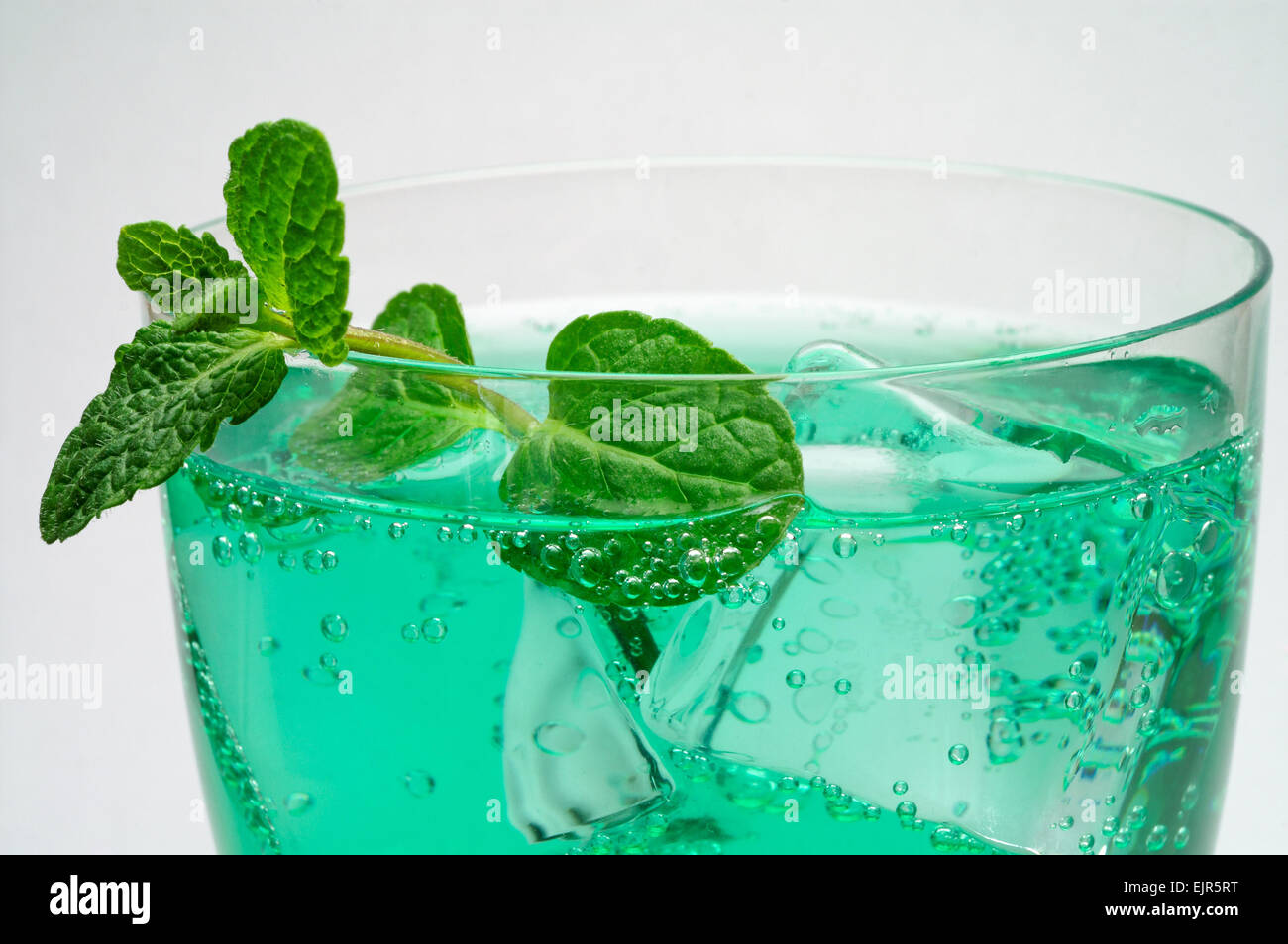 Mint drink with ice cubes and mint leaves Stock Photo