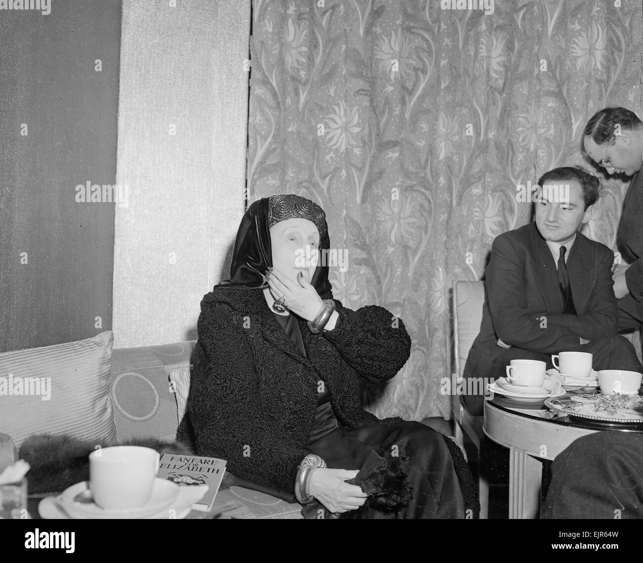 British Poet Dame Edith Louisa Sitwell seen here with her book Fanfare for Elizabeth at a press reception given in her honour. November 1952 *** Local Caption *** watscan - - 12/01/2010 Stock Photo