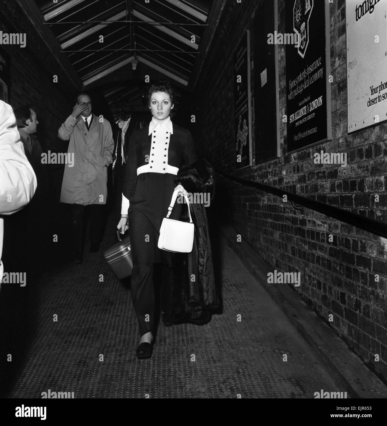 Carolyn Moore walks along the subway at Wilmslow station on her way to