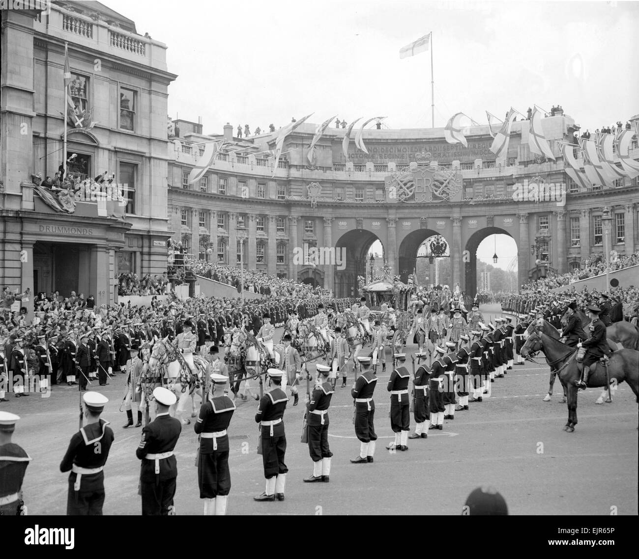 The Coronation of Queen Elizabeth II. The Queen's coach passing through ...