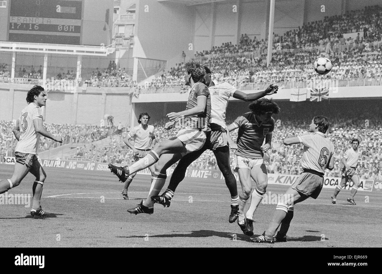 1982 World Cup Finals Group Four match in Bilbao, Spain. England 3 v France 1. England player jumpng up for the ball in the French penalty area. 16th June 1982. *** Local Caption *** Stock Photo