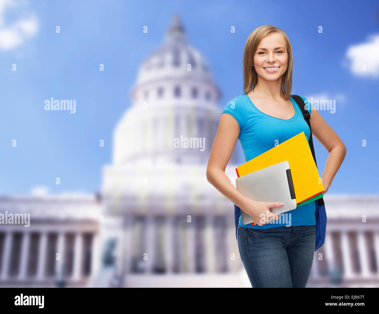smiling student with bag, folders and tablet pc Stock Photo - Alamy