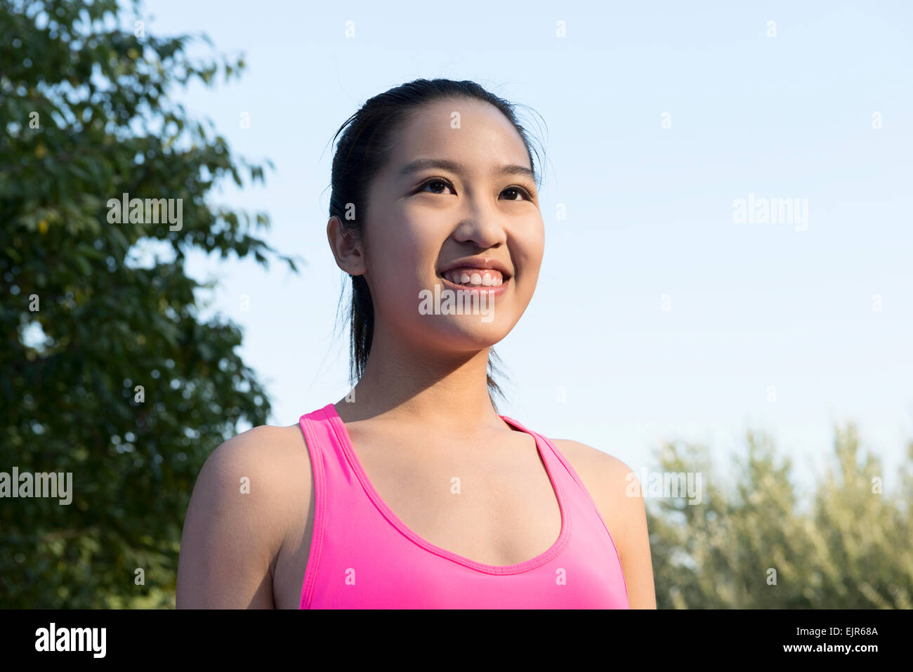 Portrait of young woman exercising Stock Photo - Alamy