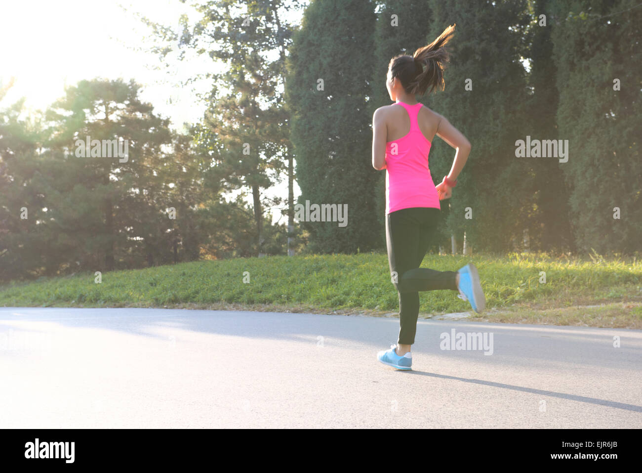 Young woman jogging Stock Photo