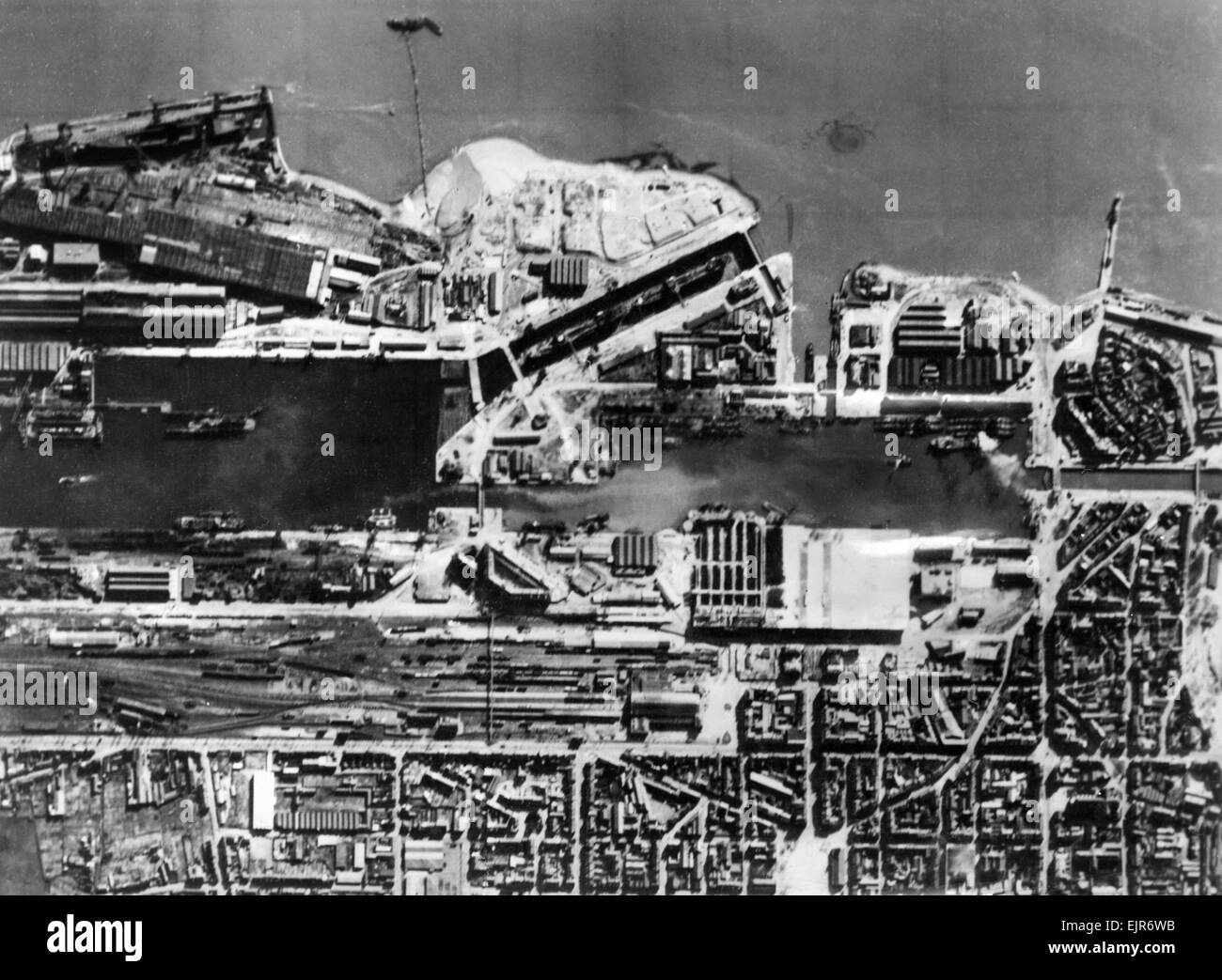 Aerial photgraph taken by an RAF reconnaisance aircraft, the day before the raid by British Royal Navy and Army commando units on the Nazi held docks at St Nazaire in occupied Northern France. In this picture the lock gate is in position. It would be destroyed in the raid when they were rammed by obselete destroyer HMS Campbelltown accompanied by 18 shallow boats. 1st April 1942. Stock Photo