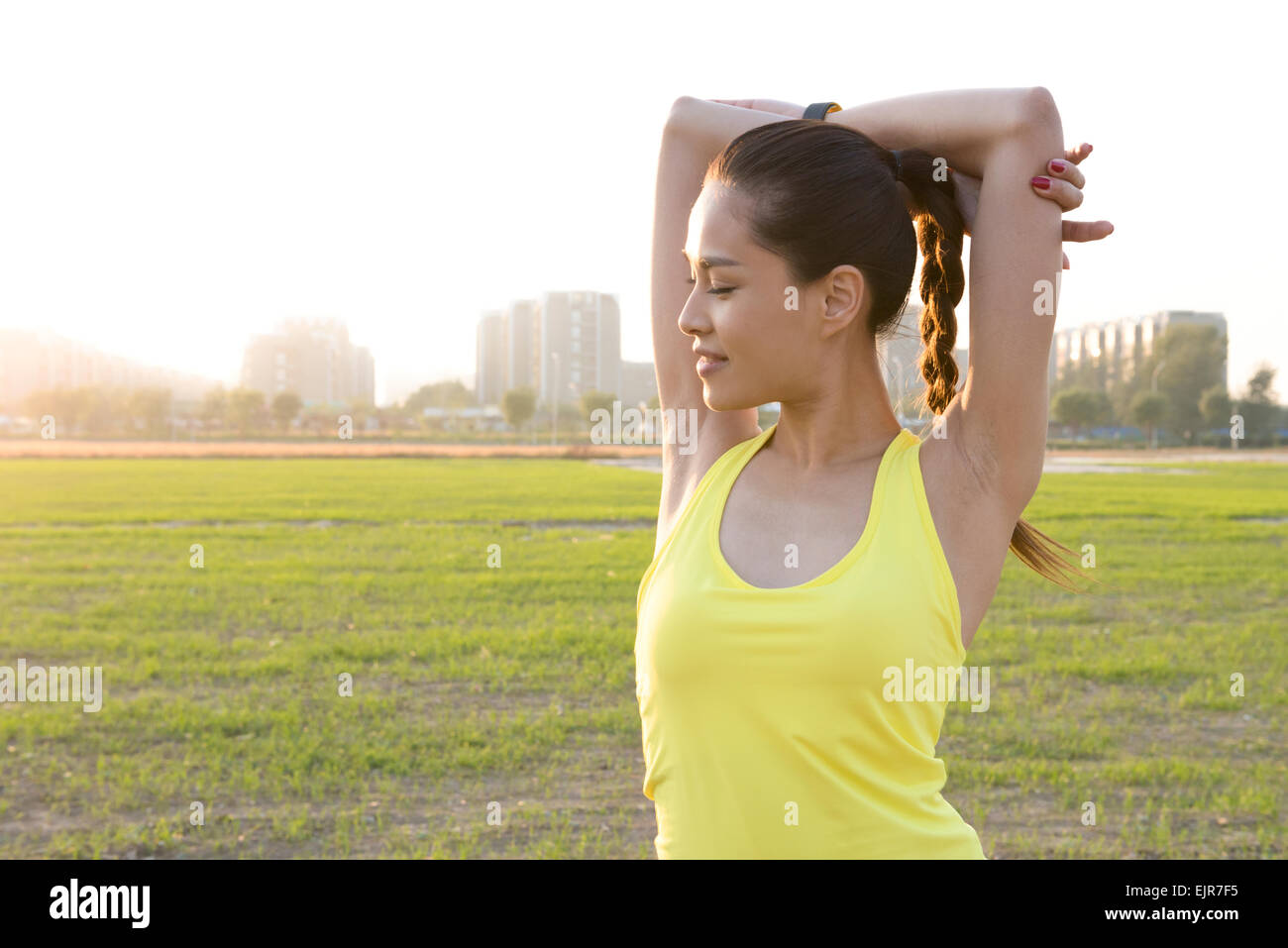 Beautiful chinese girl stretching arms hi-res stock photography and ...