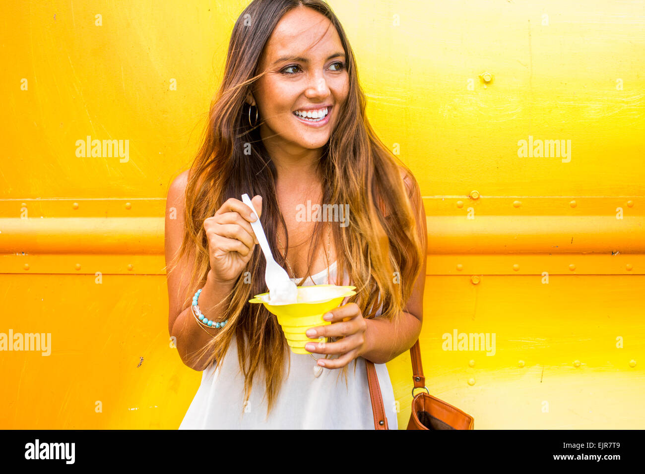 Caucasian woman eating shaved ice Stock Photo