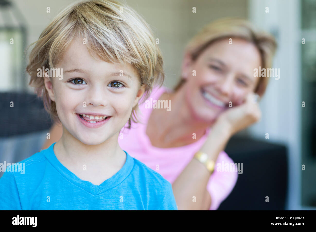 Caucasian boy smiling with mother Stock Photo