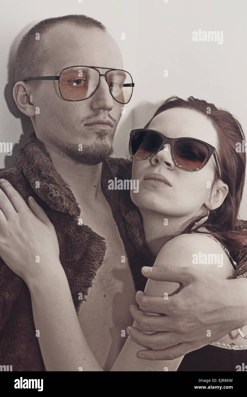 Young man and woman in sunglasses on white background Stock Photo - Alamy