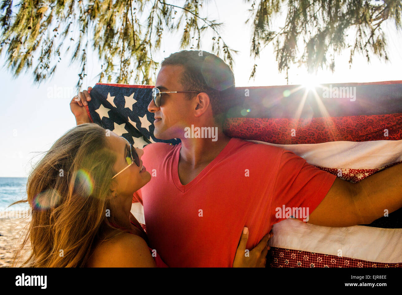 Couple holding American flag quilt Stock Photo