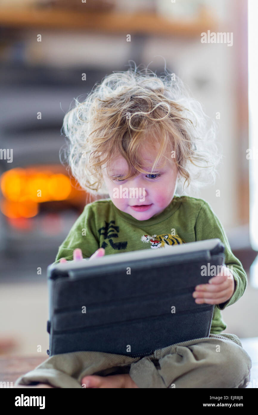 Caucasian baby boy using digital tablet Stock Photo