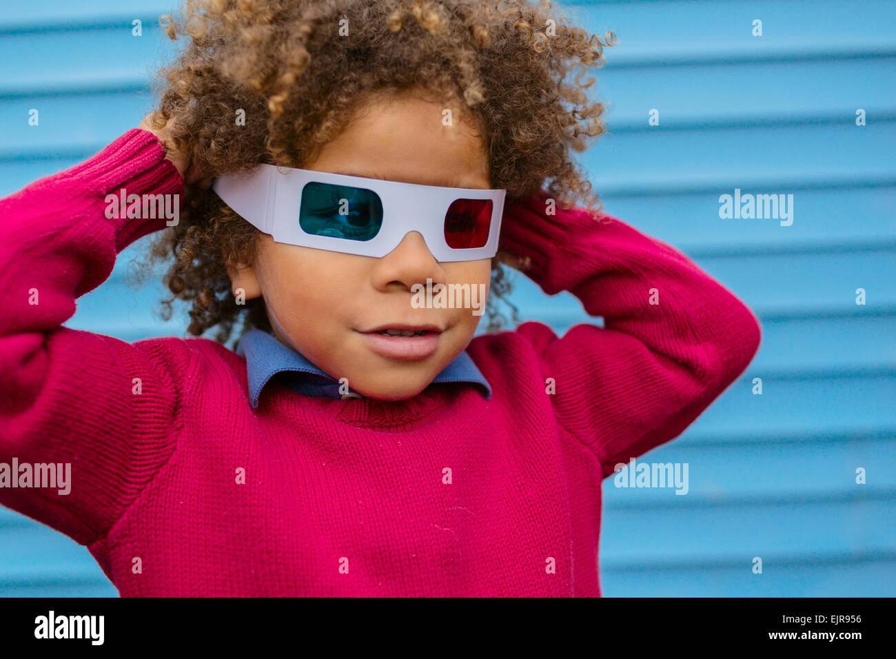 Pacific Islander boy wearing 3D glasses Stock Photo