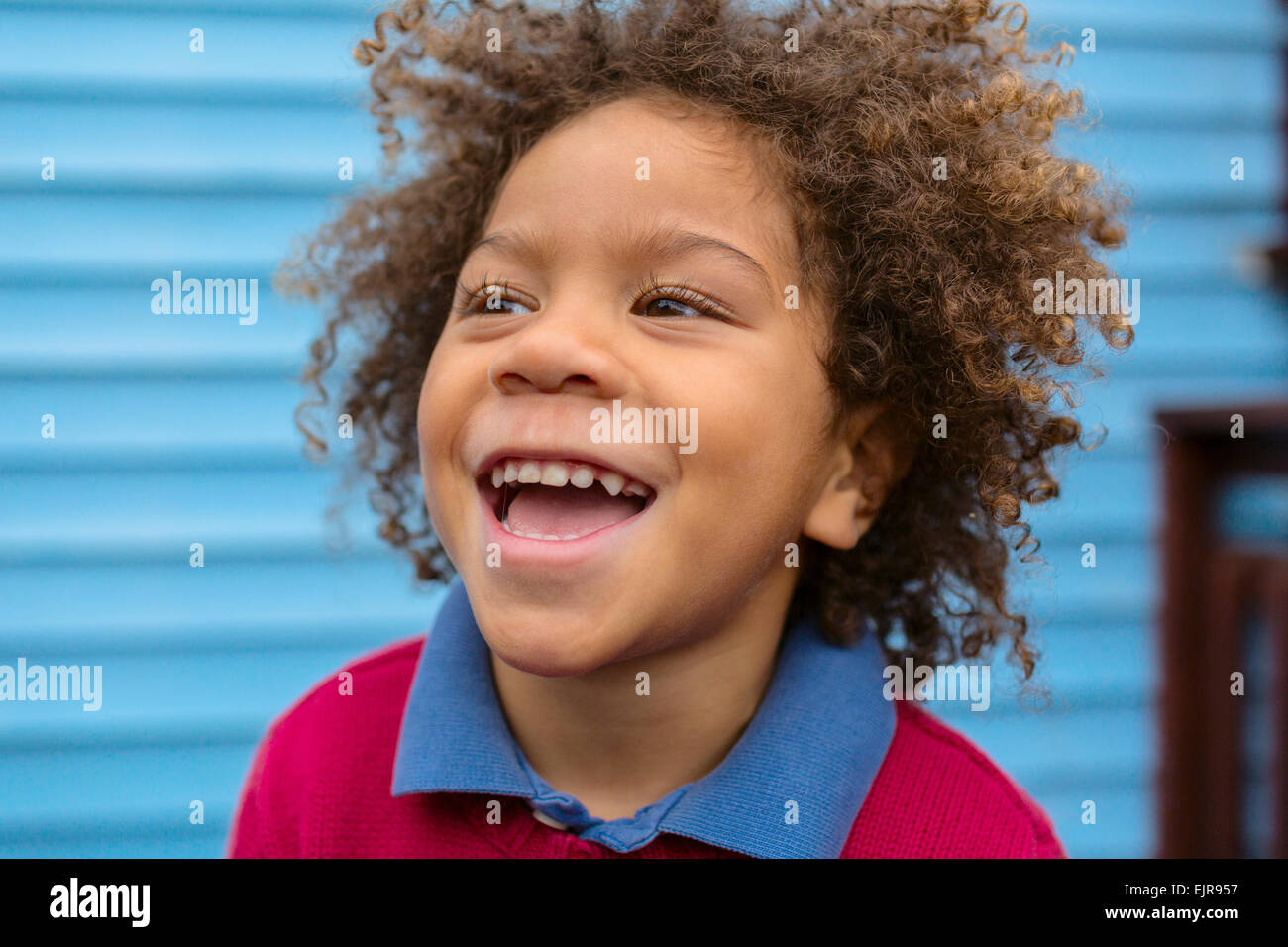 Pacific Islander boy laughing outdoors Stock Photo