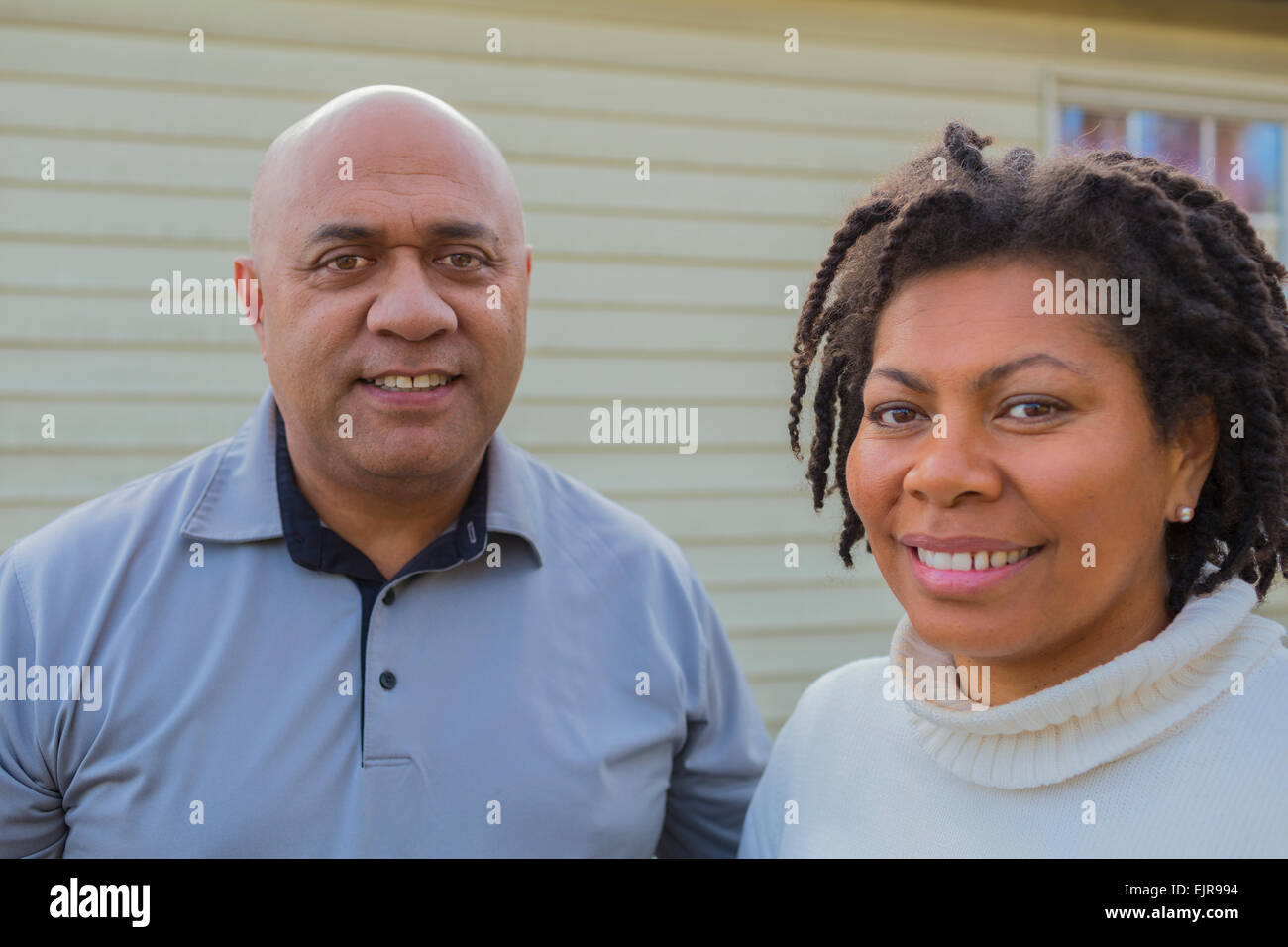Black family smiling outside house hi-res stock photography and images ...