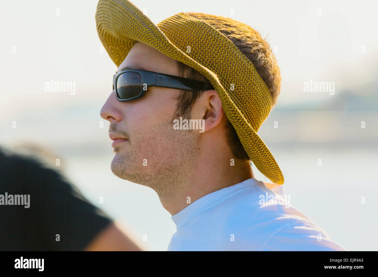 Caucasian man wearing sun hat and sunglasses Stock Photo