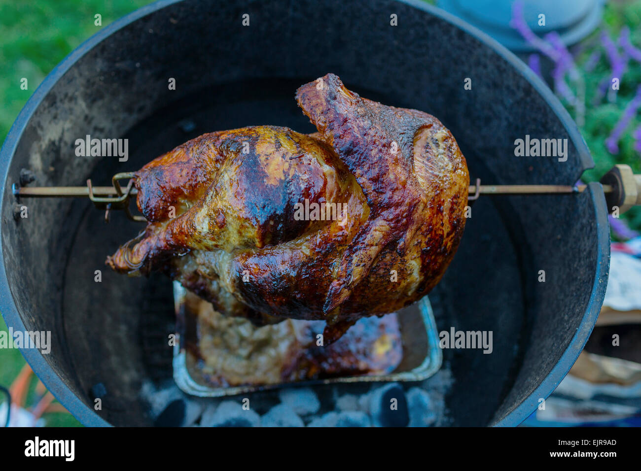 Close up of chicken cooking on rotisserie barbecue Stock Photo Alamy