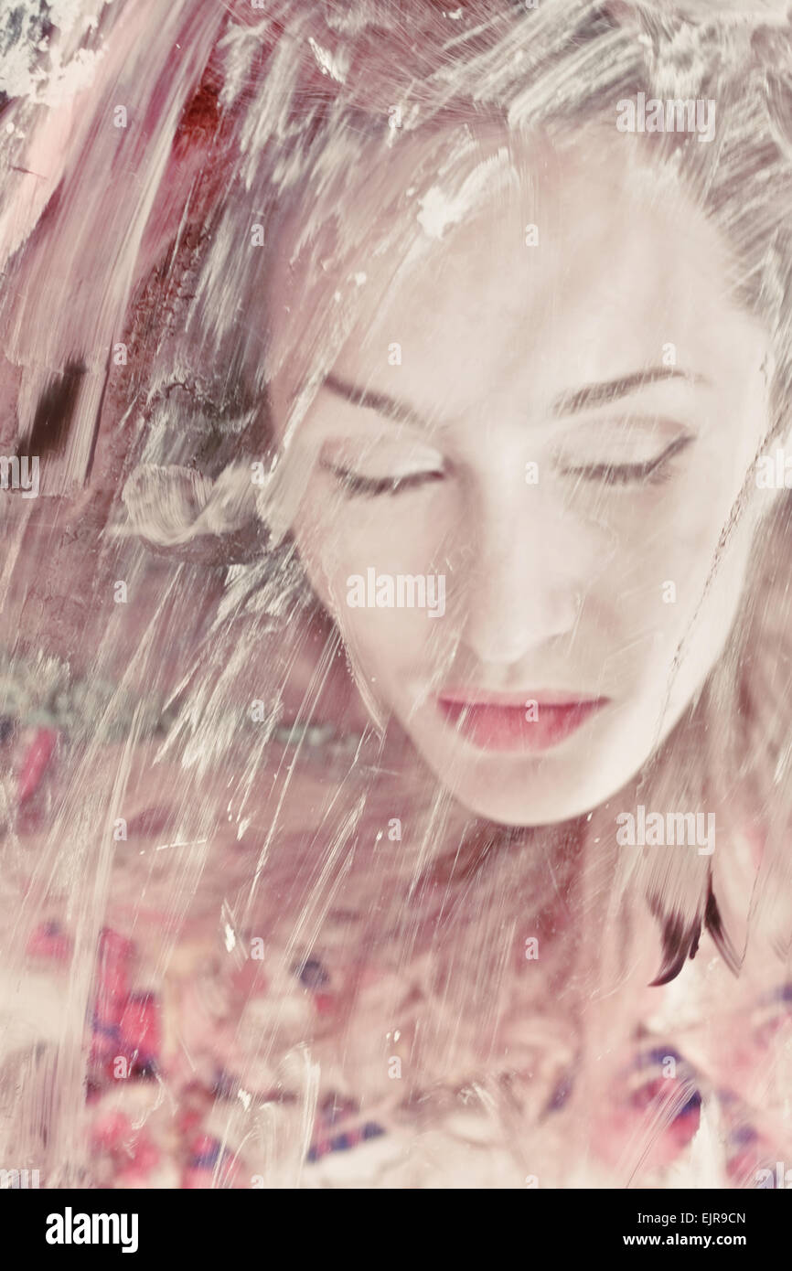 Portrait of a beautiful woman through the dirty glass closeup Stock ...