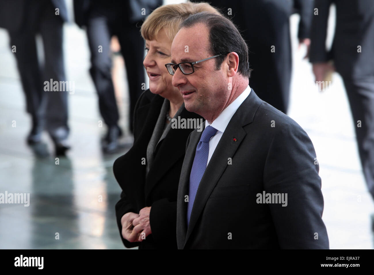 Berlin, Germany. 31st Mar, 2015. German Chancellor Angela Merkel (L) and French President Francois Hollande attend a welcome ceremony at the Chancellery in Berlin, Germany, on March 31, 2015. Credit:  Zhang Fan/Xinhua/Alamy Live News Stock Photo