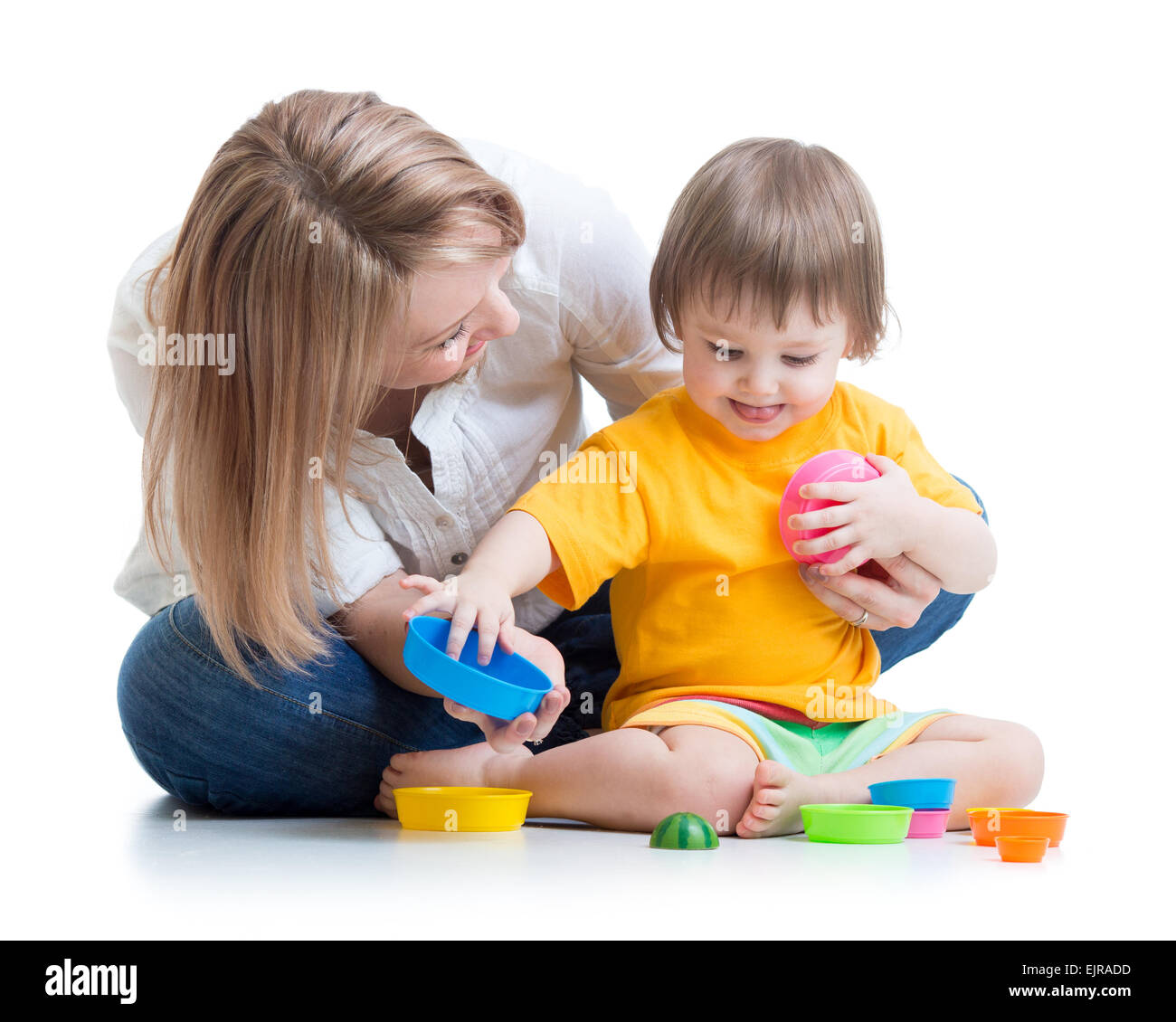 kid and mother playing with toys Stock Photo