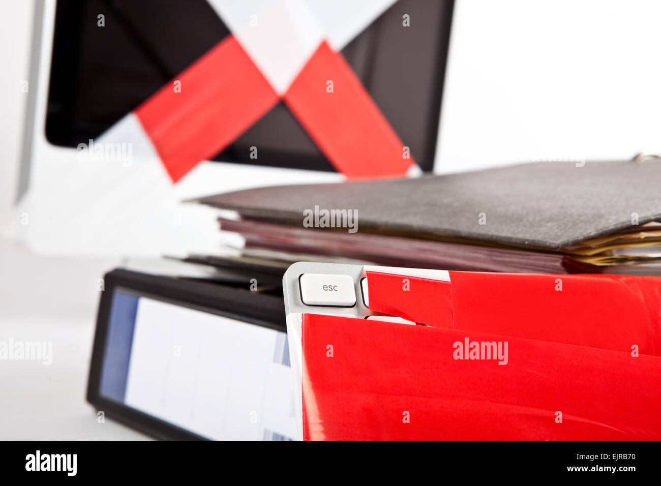 blank escape-key, keyboard and monitor wrapped in barrier tape, escape document files around, Stock Photo