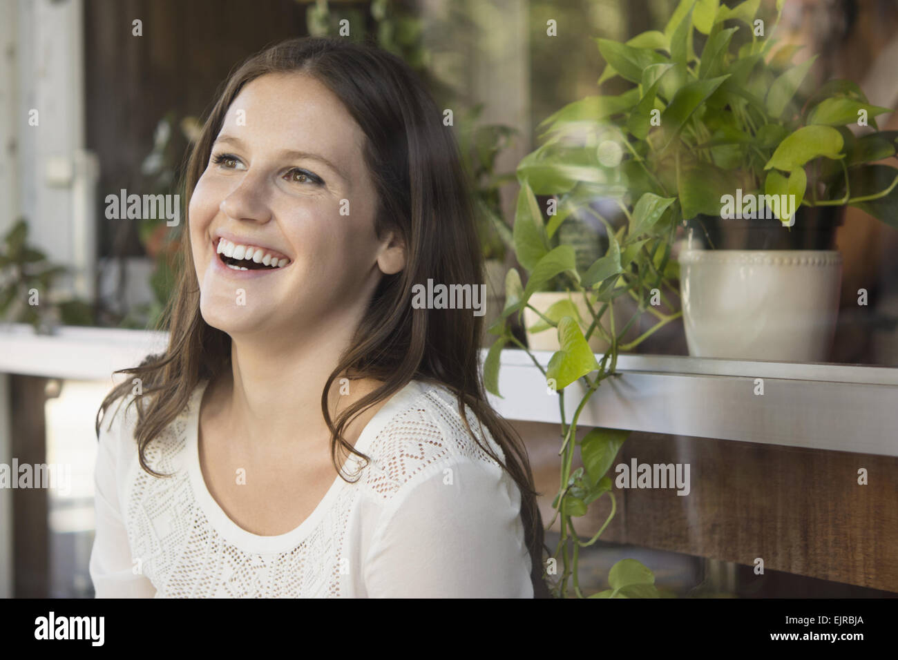 Caucasian woman laughing outdoors Stock Photo