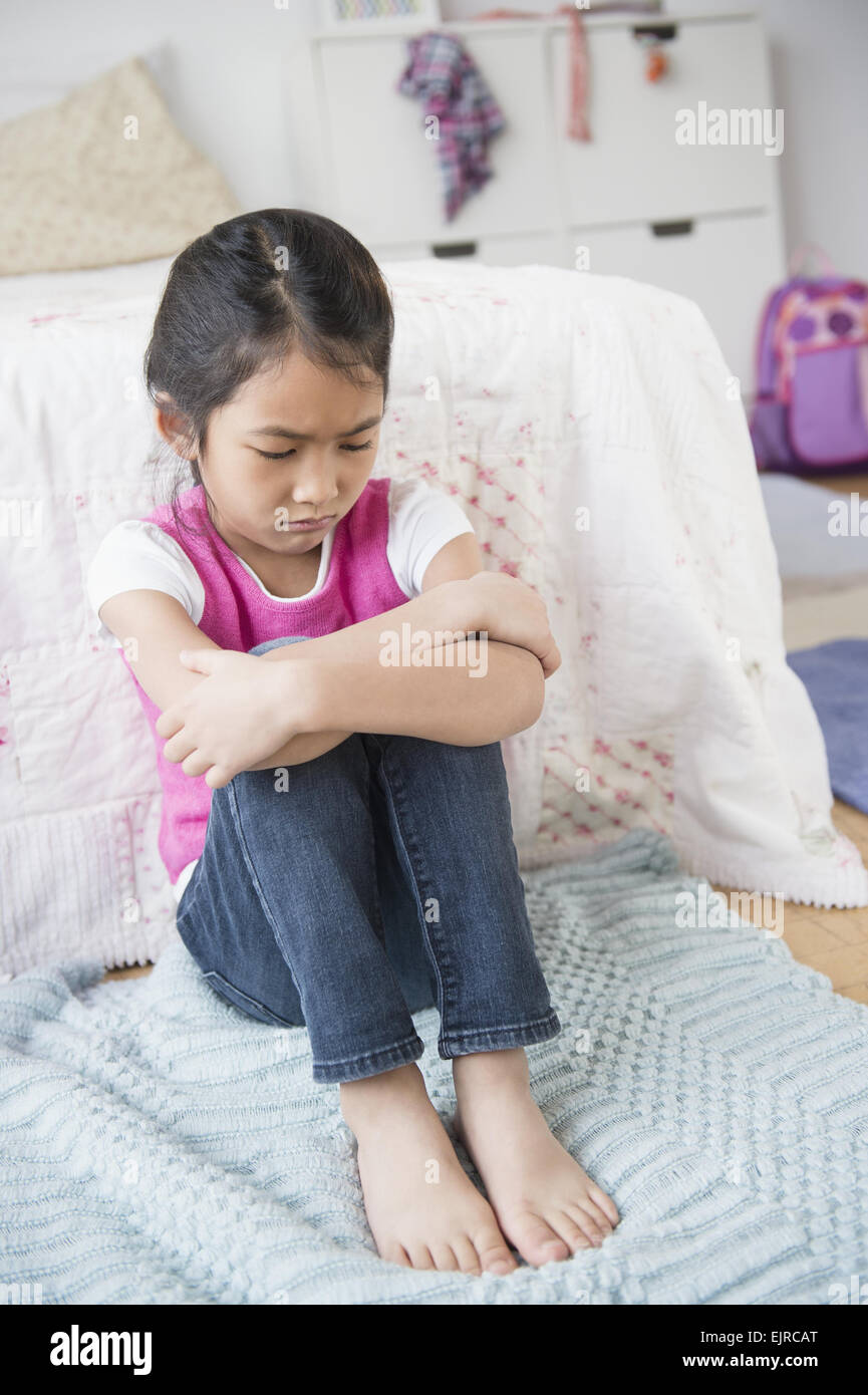 Vietnamese girl pouting in bedroom Stock Photo Alamy
