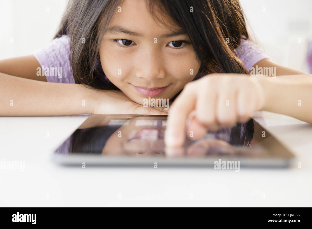 Close up of Vietnamese girl using digital tablet Stock Photo
